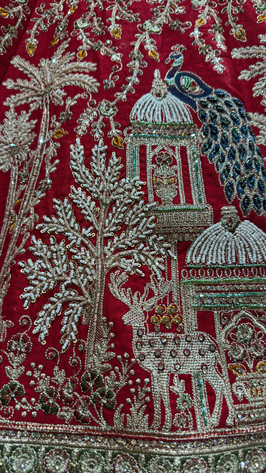 Close view of hand embroidery on a Kundans bridal textile
