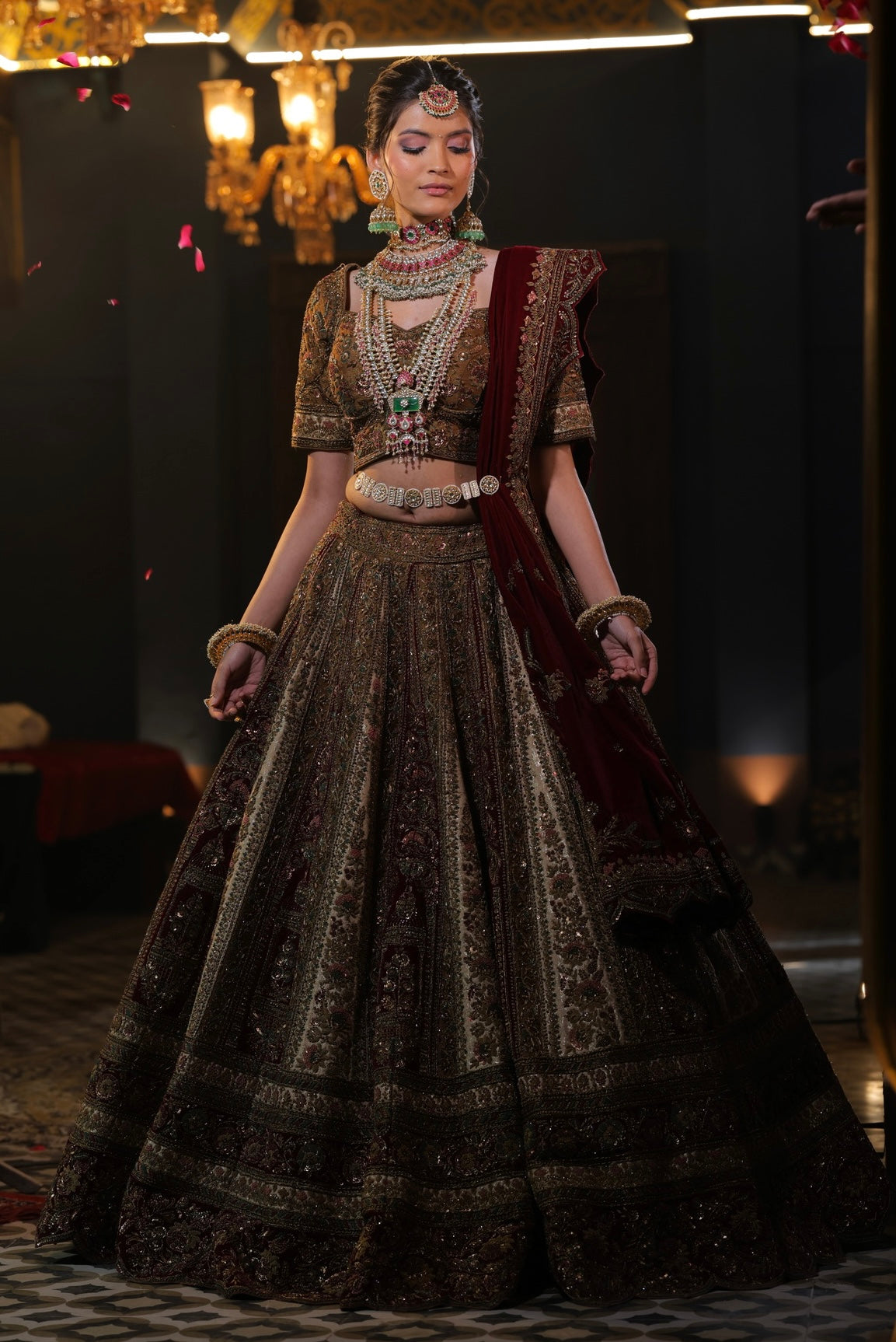 Kundans bride in a deep red embroidered bridal lehenga